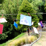 Postcards made by the artist flew from lines across the walking path.